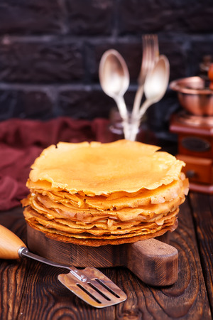 honey on plate and on a tableの写真素材