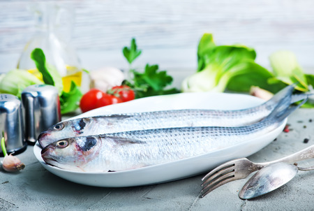 raw fish with spice and fresh saladの写真素材