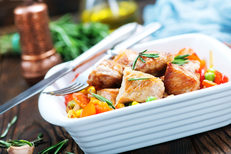 fried meat with vegetables in the bowlの写真素材