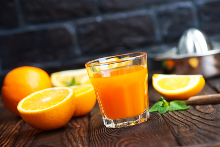 orange juice in glass and fresh fruitsの写真素材