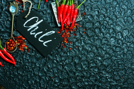 chili peppers on the black tableの写真素材