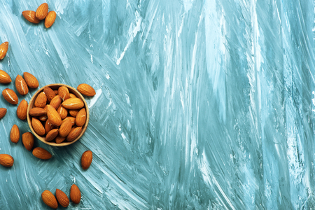 almond on a table, dry almond, nuts on wooden backgroundの写真素材