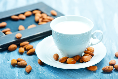 almond milk in cup on a tableの写真素材