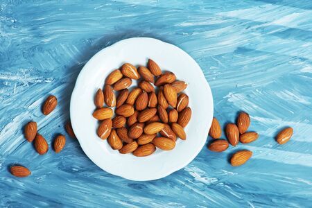 almond on a table, dry almond, nuts on wooden backgroundの写真素材