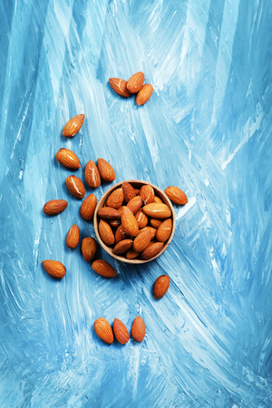 almond on a table, dry almond, nuts on wooden backgroundの写真素材