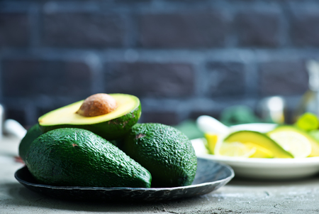 fresh avocado, lime and spice on a tableの写真素材