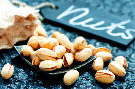 piztachios on a tabble, dry nuts, stock photoの写真素材