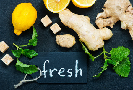 ginger with lemon and mint on a tableの写真素材