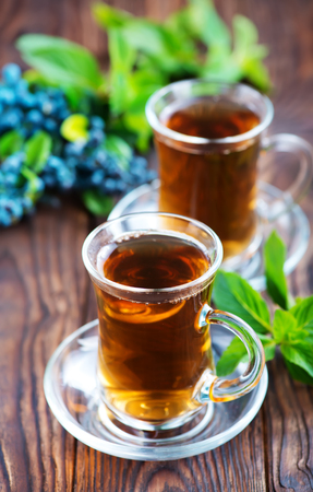 blueberry tea in cup and on a tableの写真素材