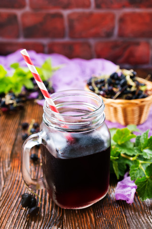 juice from black currant  in the glassの写真素材