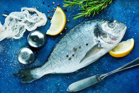 raw fish with spice and salt on a tableの写真素材