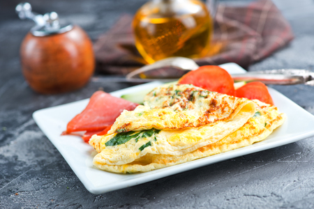 omelette with tomato on the white boardの写真素材
