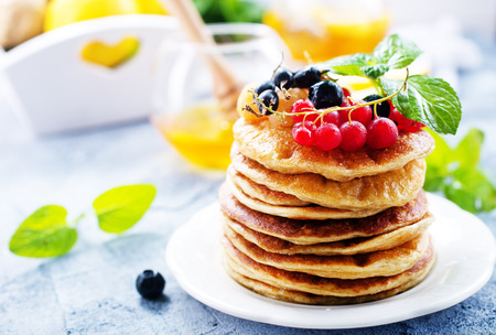 pancakes on white plate and on a tableの写真素材