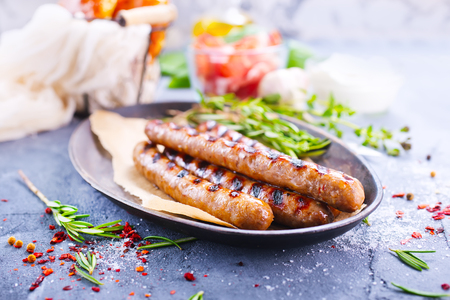sausages on plate and on a tableの写真素材