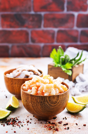 seafood in bowls and on a tableの写真素材