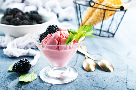 ice cream in glass bowl and on a tableの写真素材