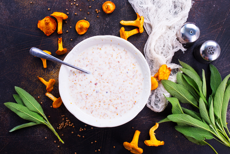 mushroom soup in bowl and on a tableの写真素材