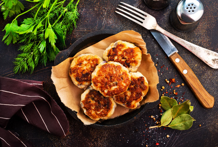 fried cutlets on plate and on a tableの写真素材