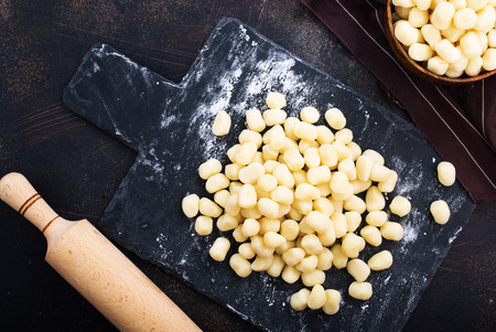raw potato gnocchi on a tableの写真素材