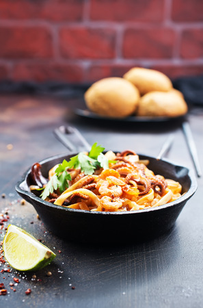 fried spaghetti with seafood in the panの写真素材