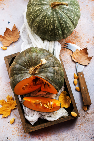 raw pumpkin on a table, stock photoの写真素材