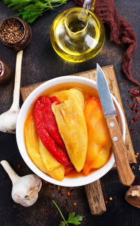 baked pepper on plate and on a tableの写真素材