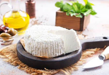 cheese on board and on a tableの写真素材