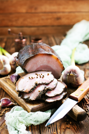 smoked lard with spice on the boardの写真素材