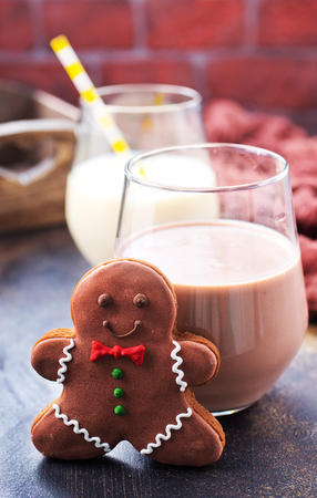 cookies and milk on a table, chocolate milk with ginger cookiesの写真素材