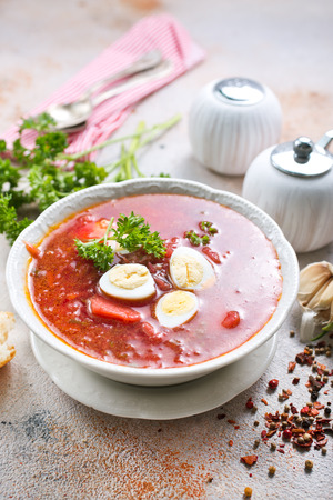 Traditional Ukrainian borsch, red beet soup with boiled eggsの写真素材