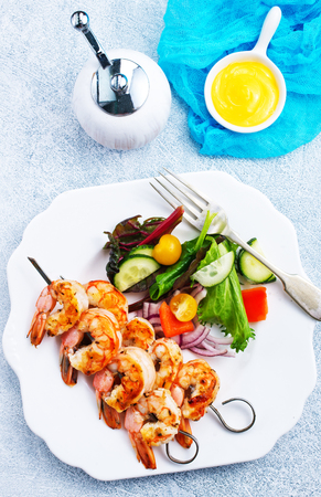 fried shrimps with salad, fried shrimps on sticksの写真素材