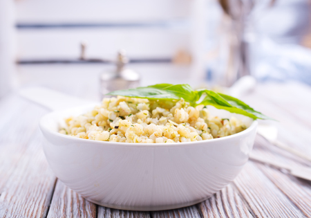 boiled bulgur with sauce Pesto in white bowlの写真素材