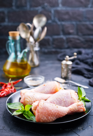 Raw meat, chicken legs, chicken with herbs and spices の写真素材