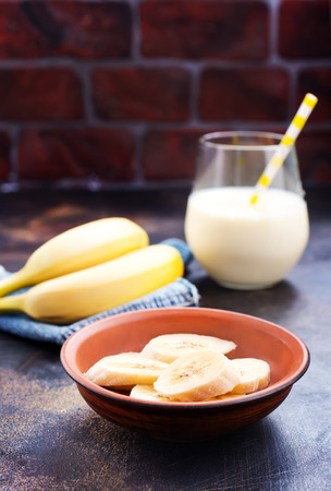 banana drink and fresh banana on a tableの写真素材