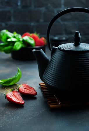 Tea with fresh basil and strawberry, fresh herbal teaの写真素材