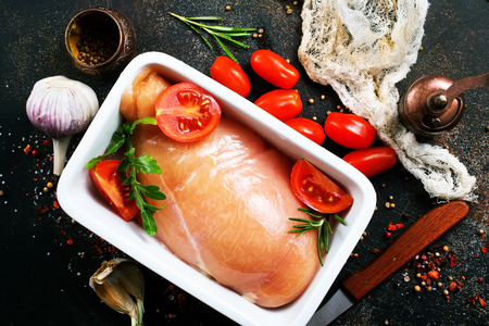 Raw chicken fillet meat in bowl for baked. Ready for cooking. Fresh Chicken breast Meat steak.の写真素材