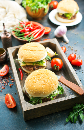 burgers in wooden box, burgers with hot chilli peppersの写真素材