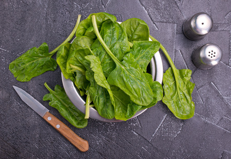 spinach leaves, fresh spinach on a tableの写真素材