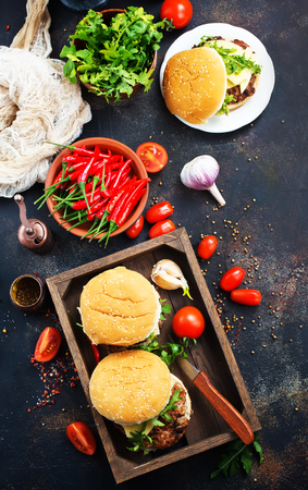 burgers in wooden box, burgers with hot chilli peppersの写真素材