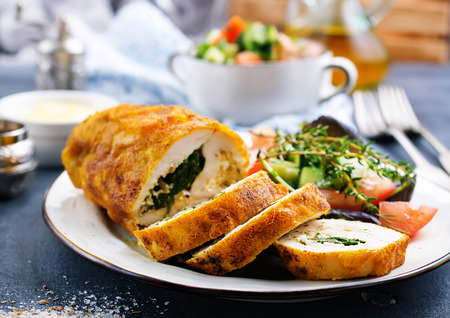 backed chicken roll with spinach and cheeseの写真素材