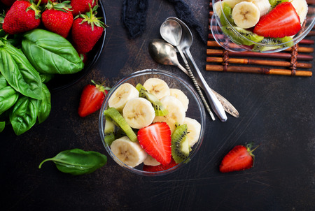 desert with fresh fruits, fruit salad, banana with strawberryの写真素材