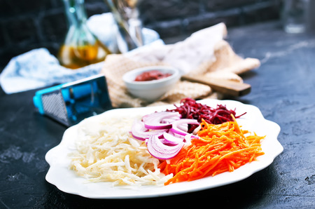 Fresh ingredients for cooking beet soup on table in kitchenの写真素材