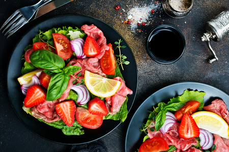Fresh salad with  hamon, blue cheese and strawberryの写真素材