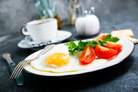 Breakfast on plate, fried eggs with vegetablesの写真素材