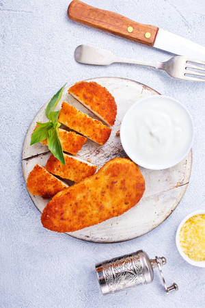 chicken fillet, fricd chicken, chicken nuggets on boardの写真素材