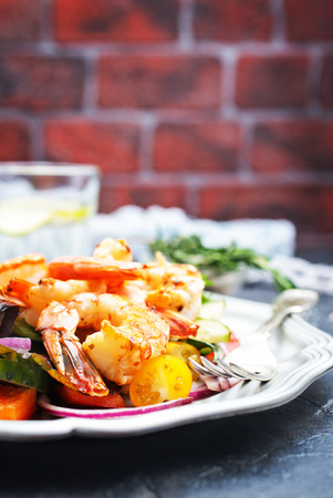 salad with fried shrimps on plate, fresh saladの写真素材