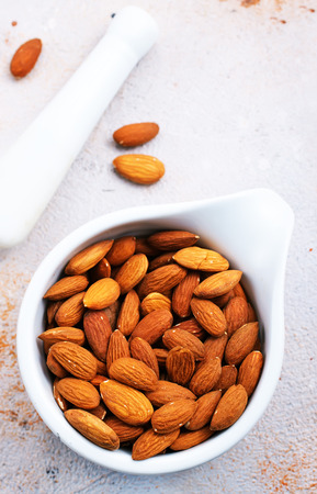 dry almond in bowl, superfood, almond and milk on a tableの写真素材