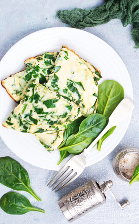 Omelette with spinach on plate, egg omeletteの写真素材