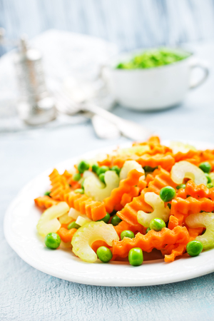 salad with fresh vegetables. salad with celery carrot peasの写真素材