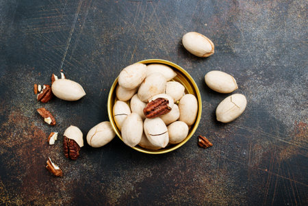 Pecan nuts in metal bowl, pecan nuts in shell